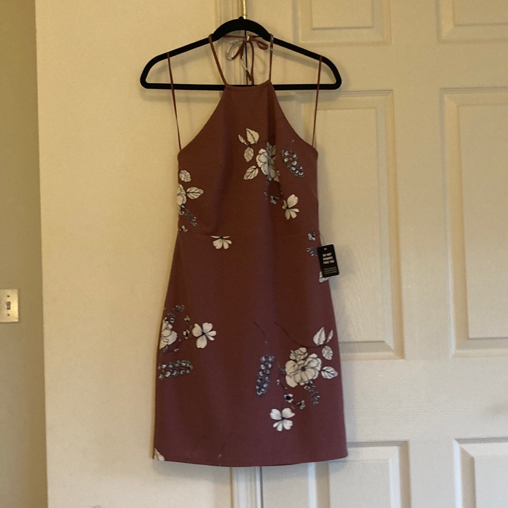 Pink mini dress with floral pattern; halter top with tie around the neck